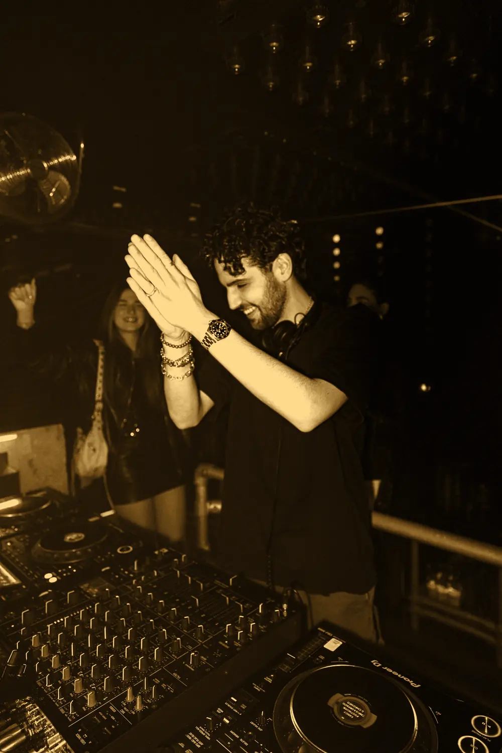 SALO at the decks, hands together, smiling