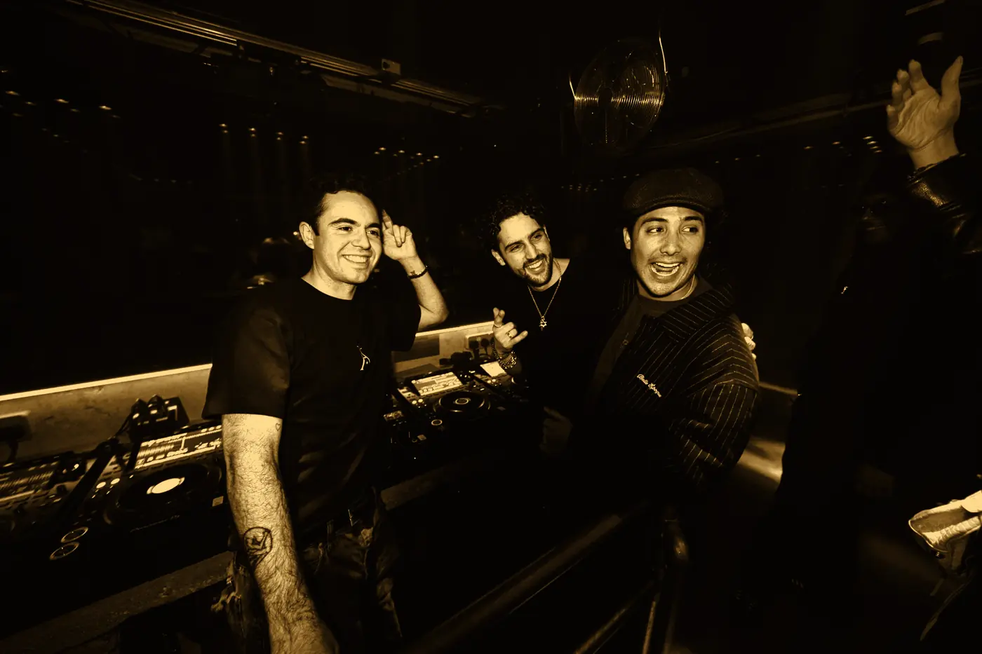 SALO and two friends laughing by the decks